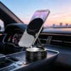 Phone on the foldable magnetic car holder standing on the dashboard at dusk