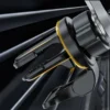 Vent clip of the magnetic phone holder mounted on a car air vent, black body with gold trim ring