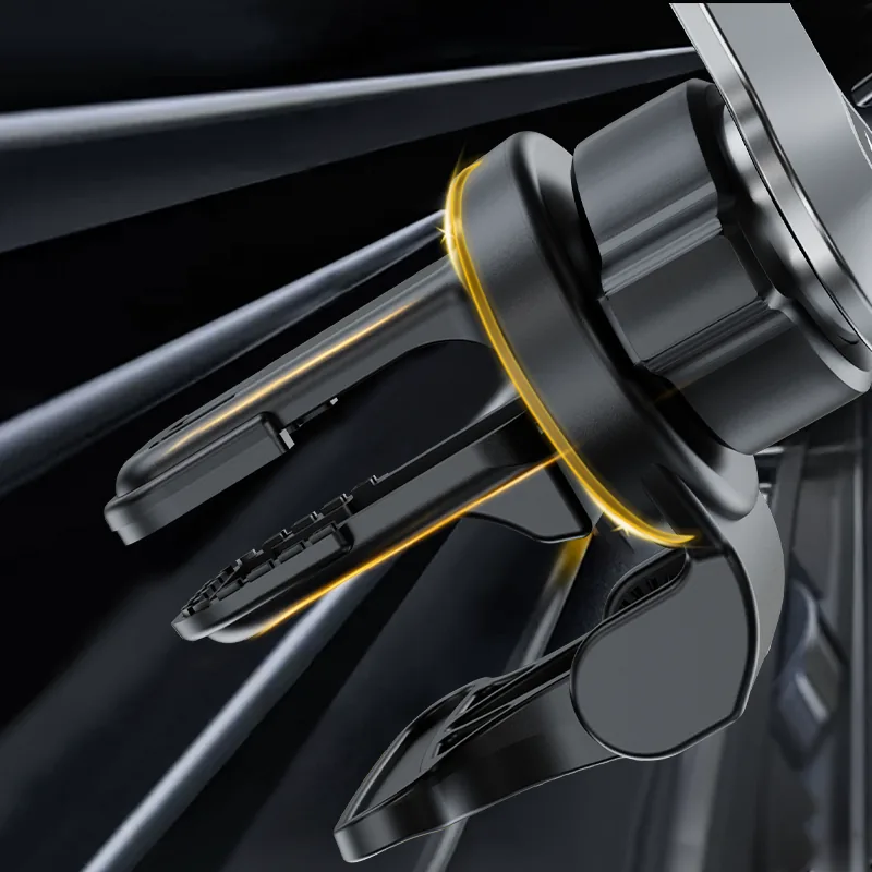 Vent clip of the magnetic phone holder mounted on a car air vent, black body with gold trim ring