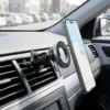 Ring magnetic car mount installed on a car air vent with the phone in place, in-car shot