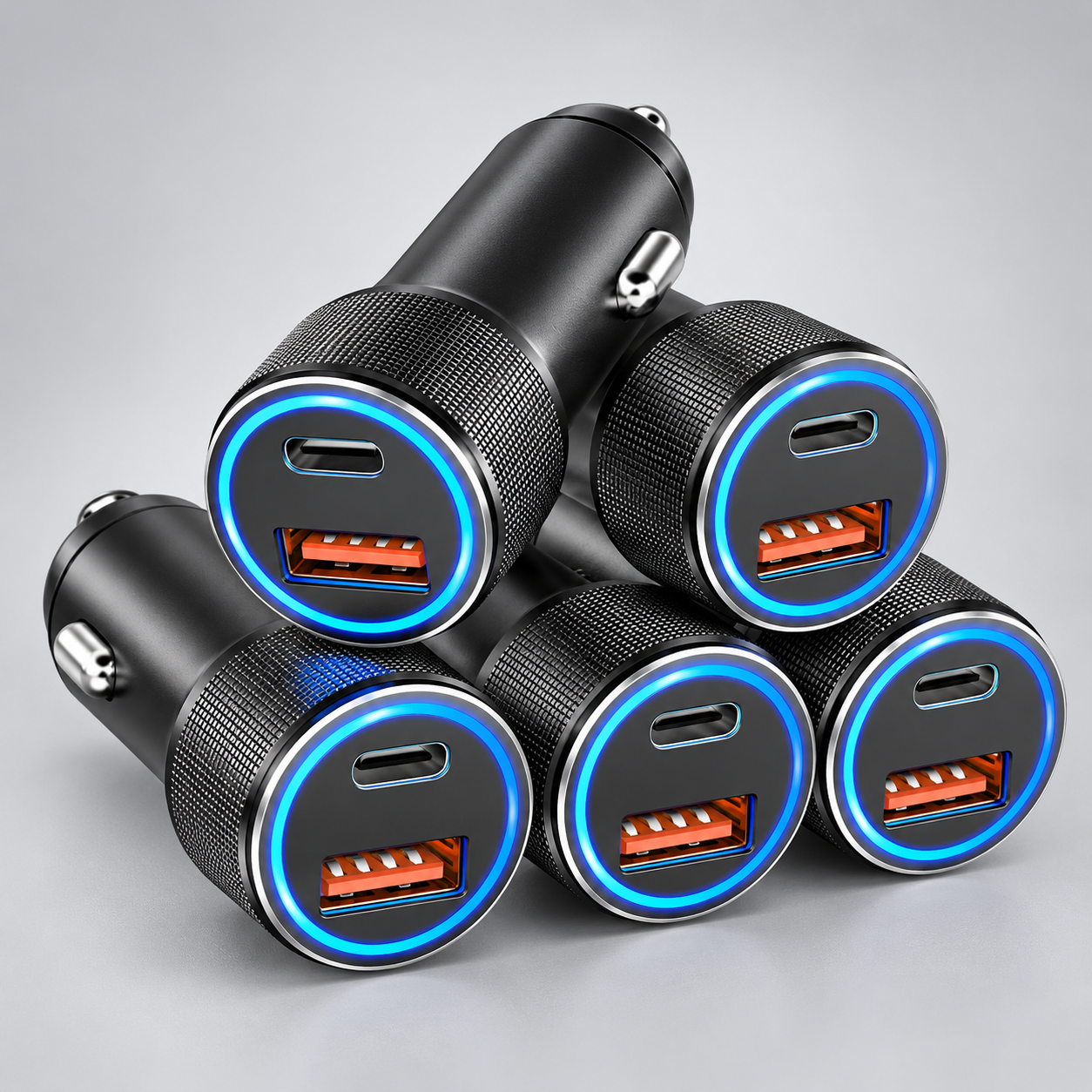 Stack of dual-port 12V car chargers with USB-C and USB-A ports